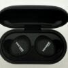 A pair of black wireless earphones