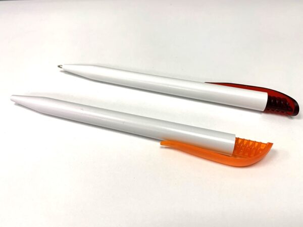 White pen with orange clip and white pen with red clip